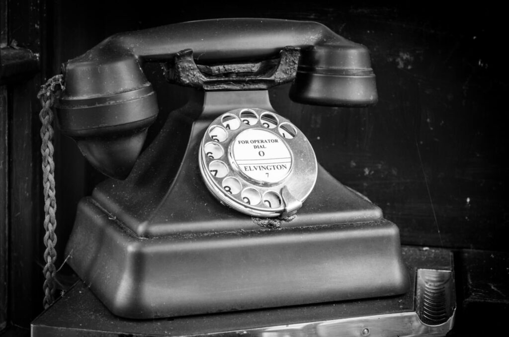 An old rotary phone, in black and white